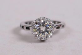 A 1.5ct white moissanite diamond, round diamond cut ring, set in sterling silver, stamped 925 and