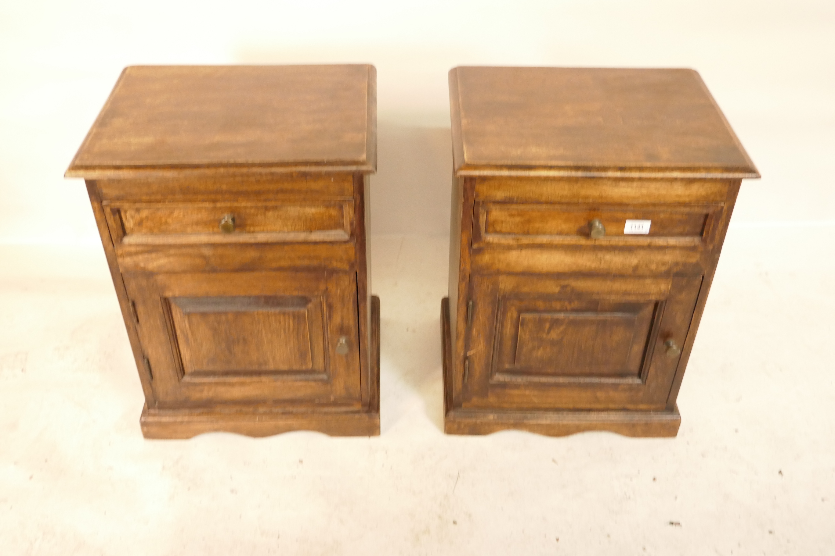 A pair of hardwood bedside cabinets with a single drawer over a door, raised on a plinth base, - Image 2 of 2
