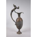 A Greco-Roman style bronze urn, the handle decorated with the bust of a siren, 18½" high
