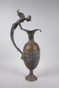 A Greco-Roman style bronze urn, the handle decorated with the bust of a siren, 18½" high