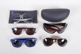 A collection of assorted designer and other sunglasses, including Yves Saint Laurent, Bruce Oldfield