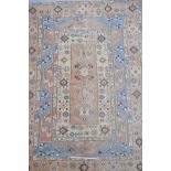 A Middle-Eastern multicoloured wool carpet decorated with geometric patterns, 76" x 104"