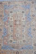 A Middle-Eastern multicoloured wool carpet decorated with geometric patterns, 76" x 104"