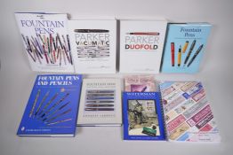 A collection of pen collecting reference books, including 'Parker Vacumatic' and 'Parker Duofold' by