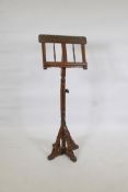 A stained beechwood music stand with mother of pearl inlay and painted decoration, raised on a