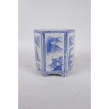 A Chinese blue and white porcelain hexagonal brush pot with decorative panels depicting riverside