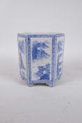 A Chinese blue and white porcelain hexagonal brush pot with decorative panels depicting riverside