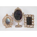 Three gilt metal framed dressing table mirrors, pedestal mirror 15½" high