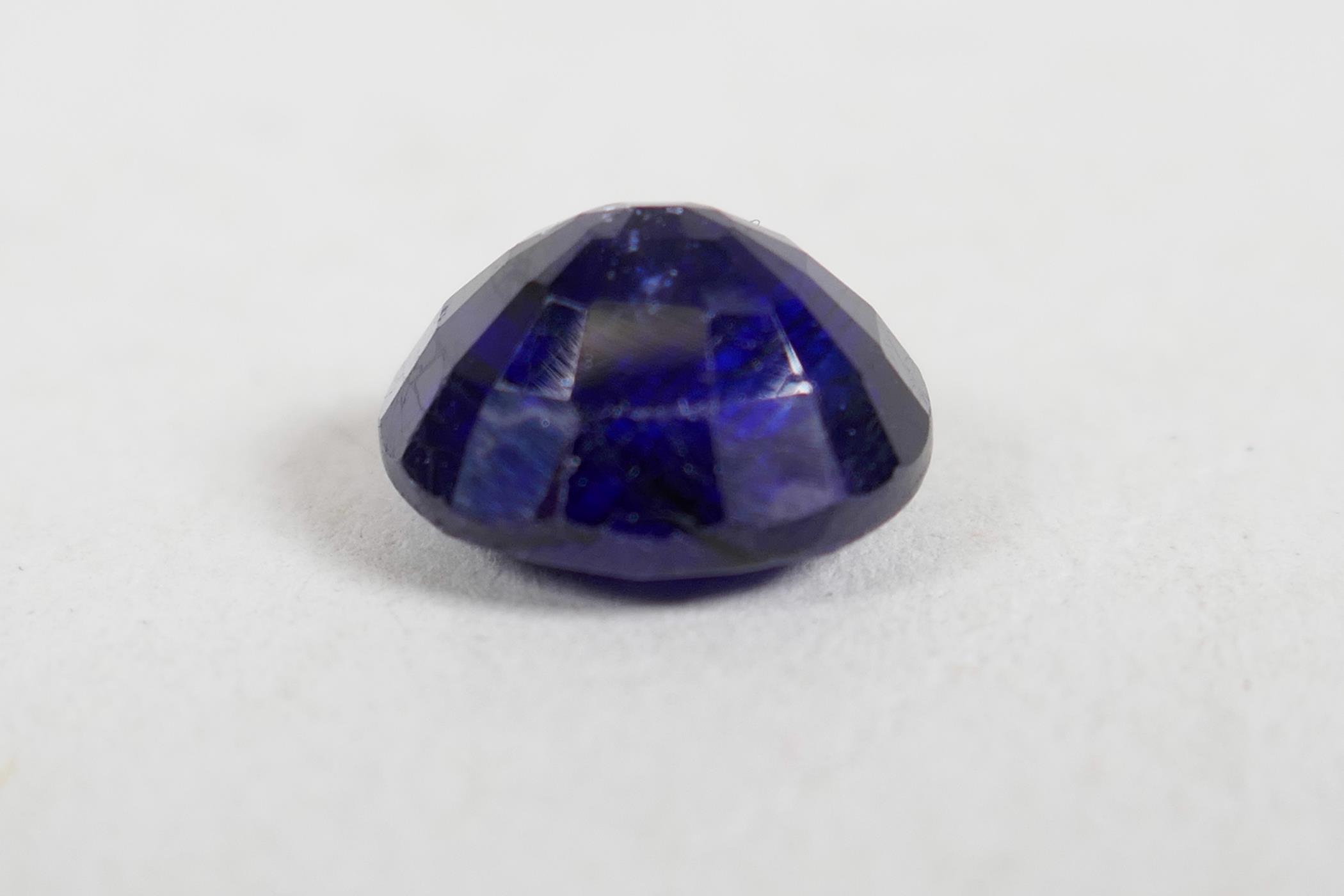 A 5.60ct blue sapphire, oval cushion cut, GJSPC certified, with certificate - Image 2 of 5