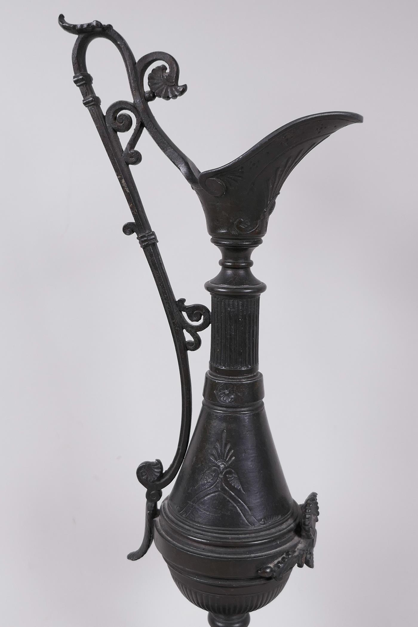 A C19th aesthetic bronze ewer with engraved and applied decoration, mounted on a marble base, 17" - Image 2 of 5