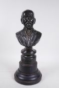 A bronzed bust of a bearded gentleman, inscribed verso Robert J Kelly(?) '26, mounted on a wood