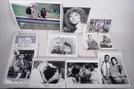 A collection of film lobby cards, photographic press kits, and a signed photograph of Barbra