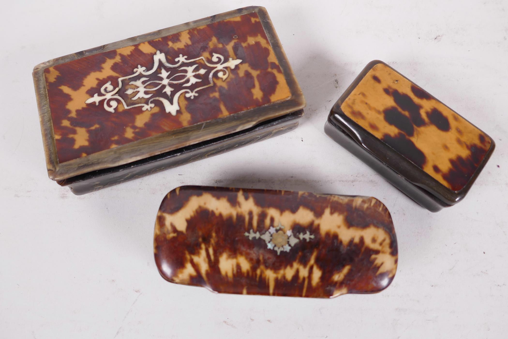 Three bone and tortoiseshell snuff boxes, the covers inlaid with silver, largest 4" long (3)