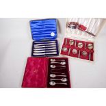 A boxed set of hallmarked coffee spoons and tongs (Sheffield 1904), 67 grams, together with a
