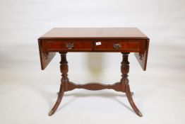 A mahogany veneered two drawer sofa table, with pierced plate handles, 36" x 20" x 29"