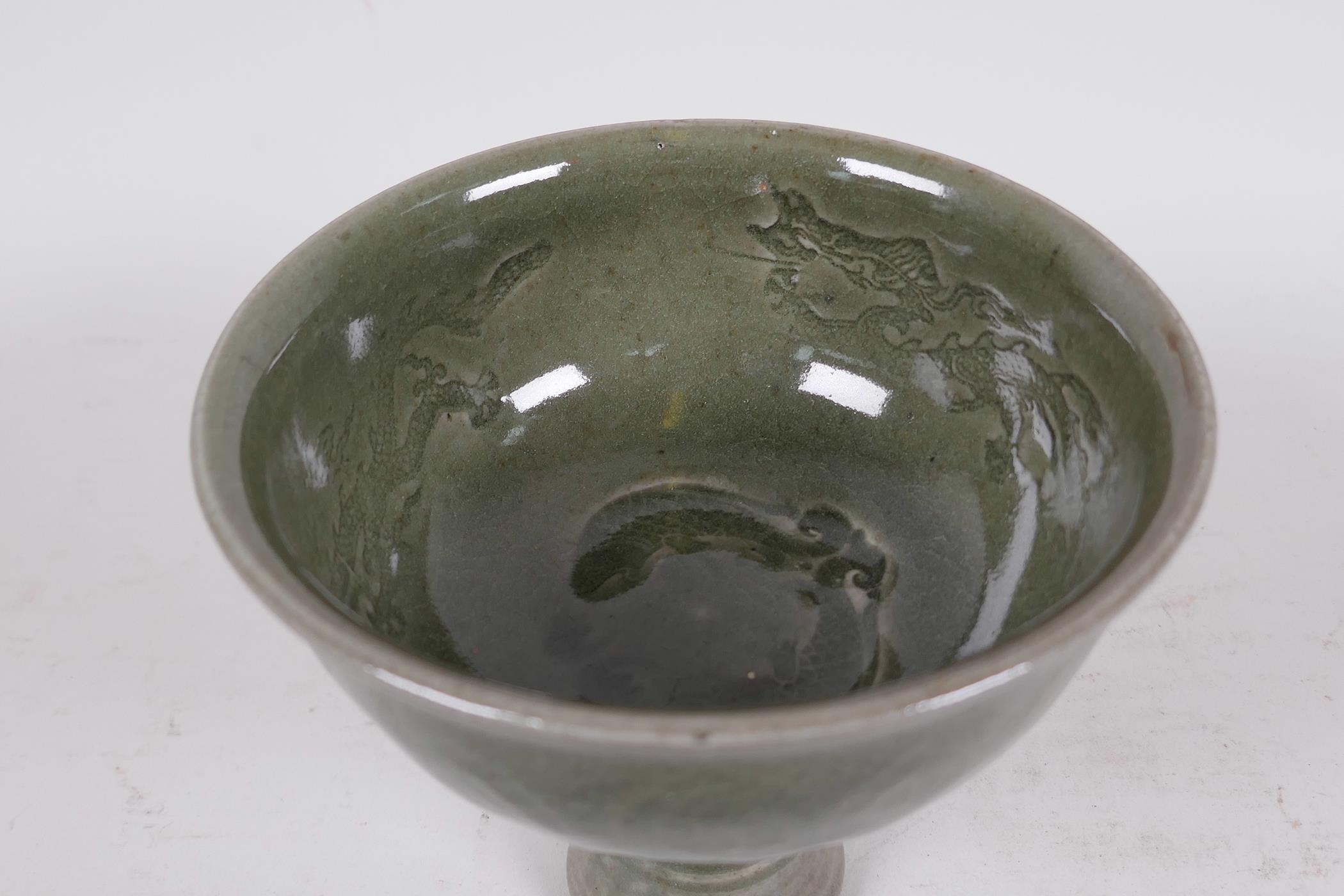 A Chinese dark green jade celadon stem cup decorated with dragons and fish, 5" high - Image 2 of 4