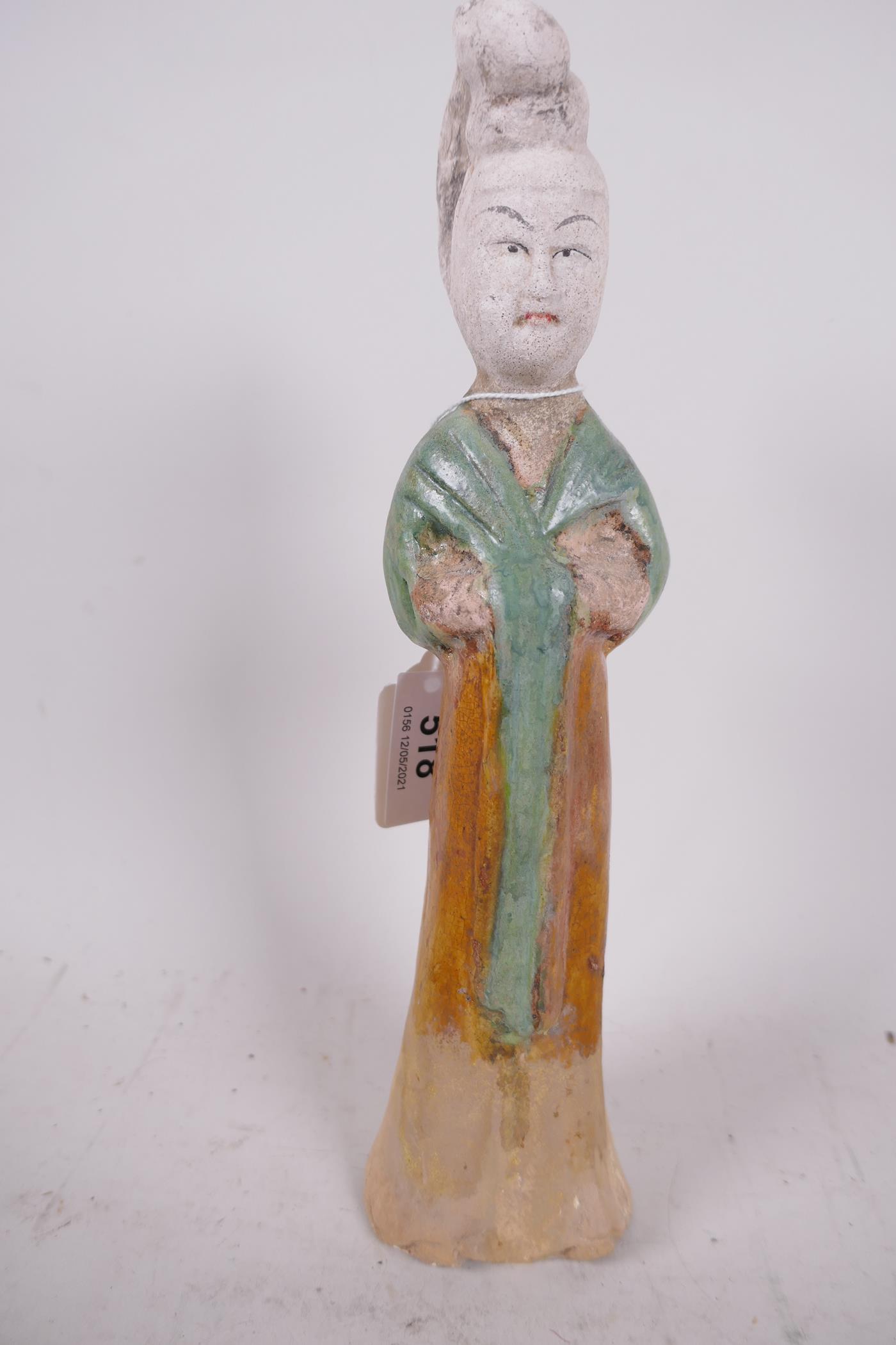 A Chinese Tang dynasty (618-907AD) terracotta figure of a court lady, Sancai glazed in original