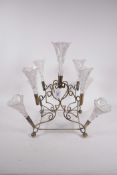 A late C19th brass and glass table centrepiece with nine cut glass trumpets (one repaired), 19"