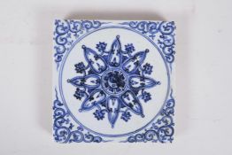 A Chinese blue and white porcelain Ming style temple tile with Yin Yang decoration, 7½" x 7½"