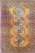 A Turkmen gold ground wool rug with a Bokhara design, 42" x 60"