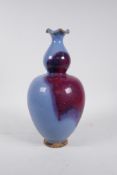 A Chinese Jun ware double gourd vase with a frilled rim, 12" high