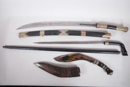 A Gurkha kukri with horn handles and leather scabbard, together with two Burmese short swords with