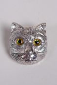 A sterling silver brooch in the form of a cat's head, in the Louis Wain style, 1½"