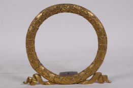 An ormolu frame in the form of a laurel wreath, 5" diameter