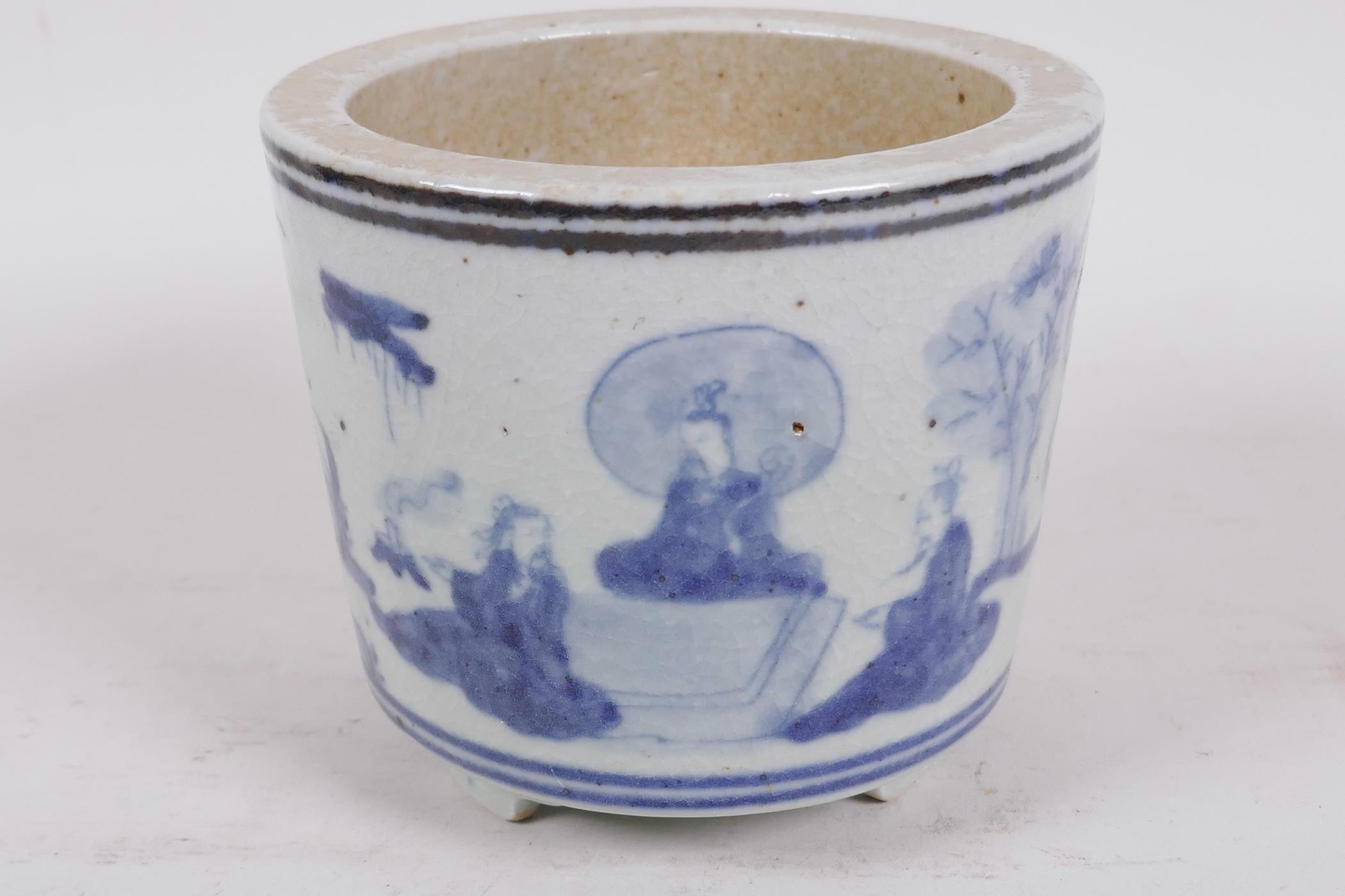 A squat Chinese blue and white porcelain cylindrical base on three feet decorated with figures in - Image 2 of 4