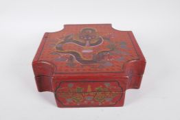 A Chinese red lacquer box with engraved and painted dragon decoration to cover and sides, 9½" x 9½"