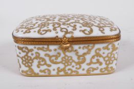 A French porcelain trinket box with gilt scrolling decoration, 4" x 3" x 2"