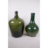 A green glass bulbous bottle, 14½" high, and an Italian green glazed vase with bulbous base and