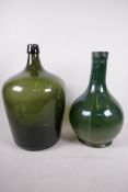 A green glass bulbous bottle, 14½" high, and an Italian green glazed vase with bulbous base and