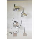 Three aluminium industrial lamps, 13" diameter, and two stands