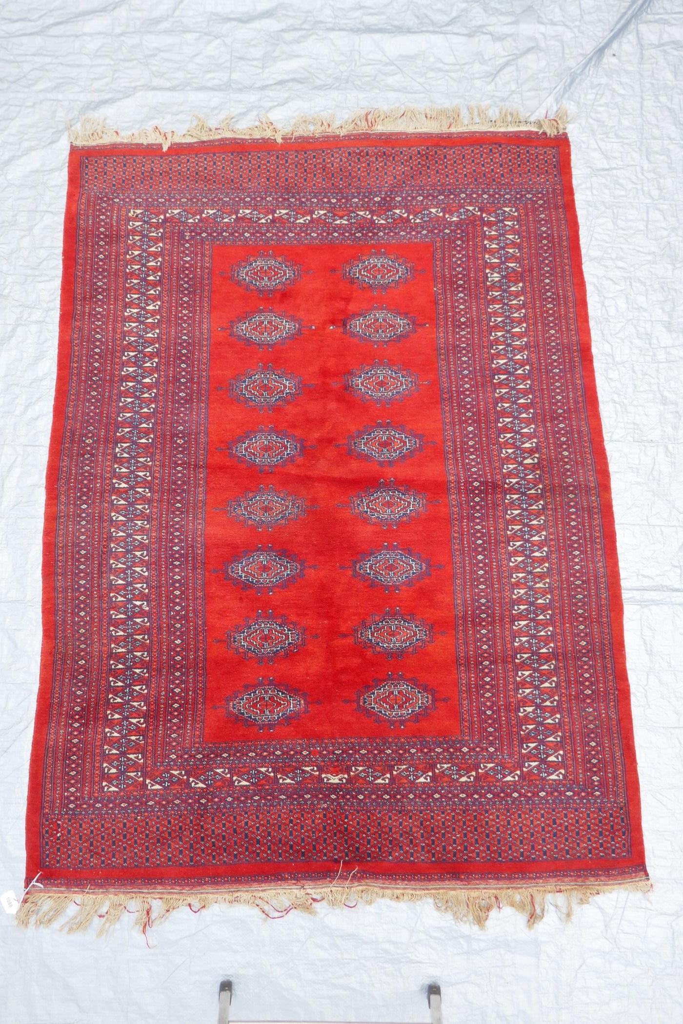 A Turkmen tomato ground wool carpet with a Bokhara design, 51" x 72" - Image 2 of 6