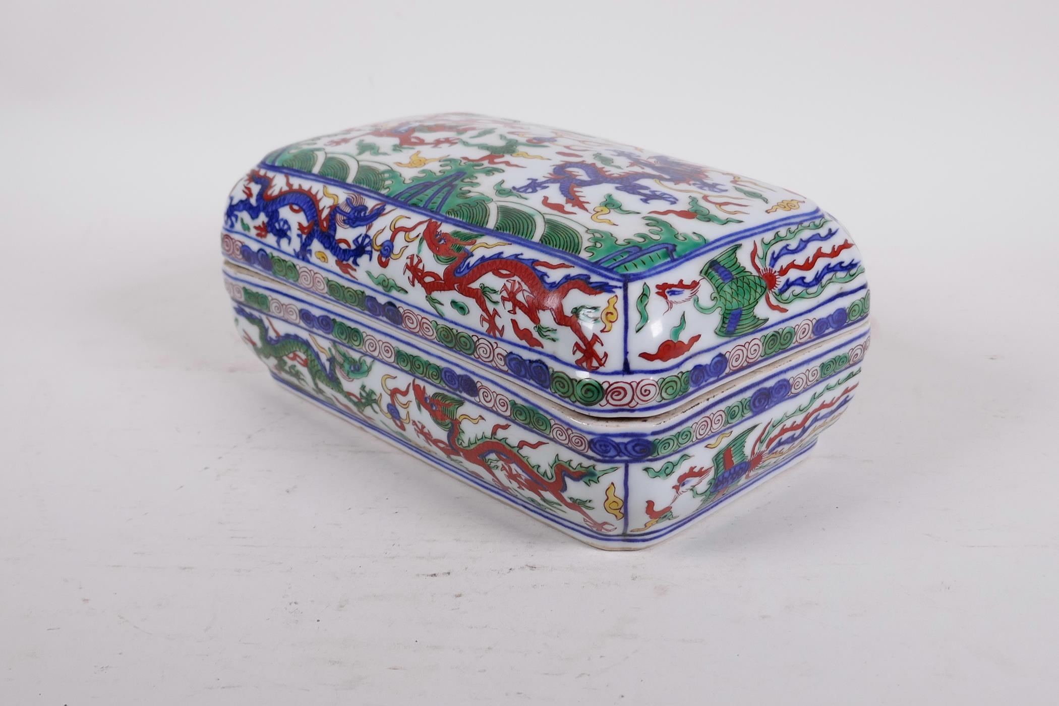 A Chinese wucai porcelain box and cover decorated with dragons and phoenix chasing the flaming - Image 2 of 4