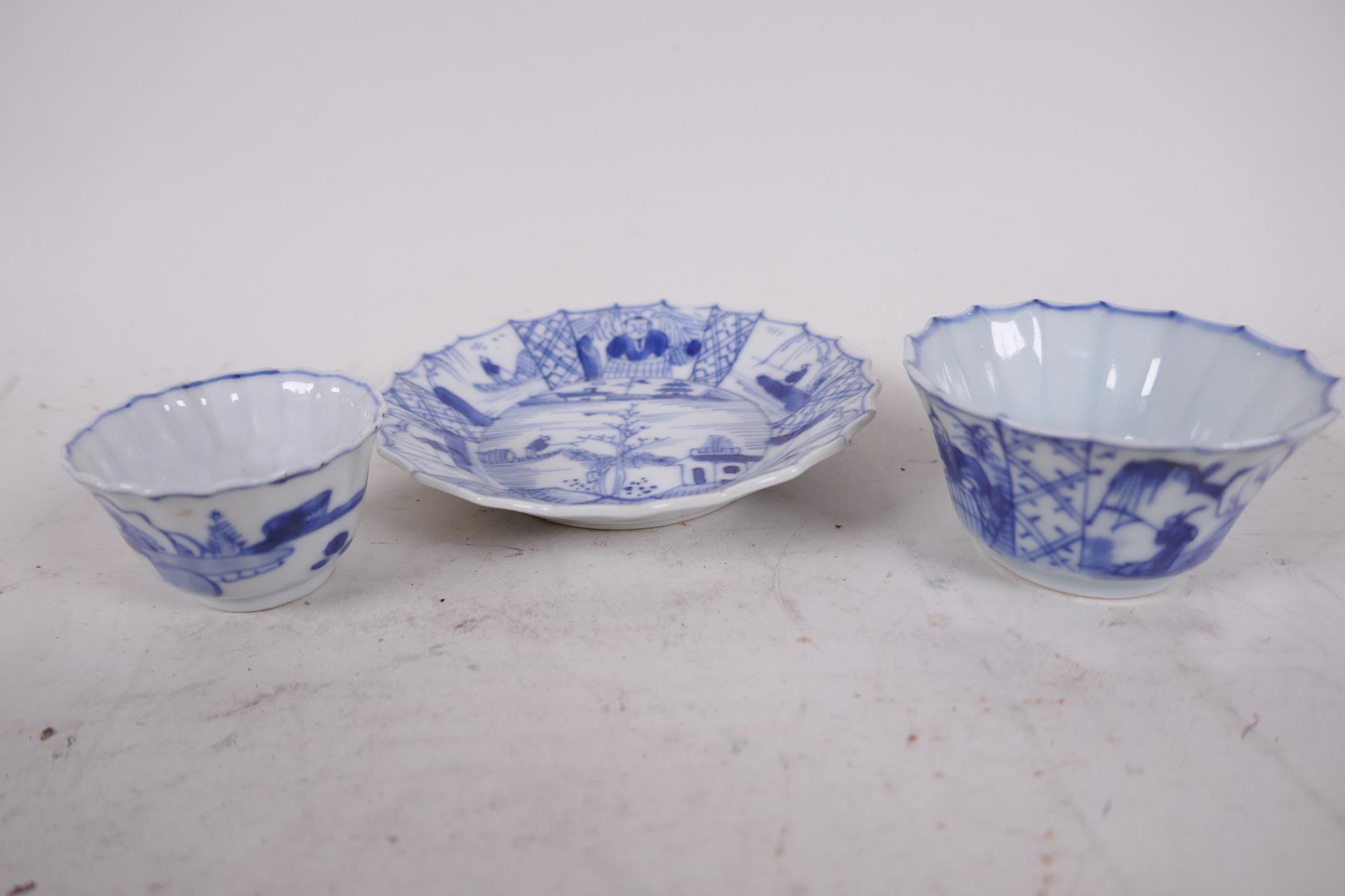 Two Chinese Yongzheng (1723-1735) blue and white fluted tea bowls with a matching saucer, saucer