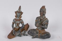 A pair of Thai bronze figures of musicians, with gilt patination and gilt highlights, 6" high