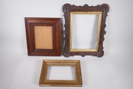 A C19th carved oak picture frame, a Victorian carved oak frame, and a gilt picture frame, largest