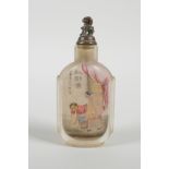 A Chinese reverse decorated glass snuff bottle depicting an erotic scene, inscription verso, 3½"