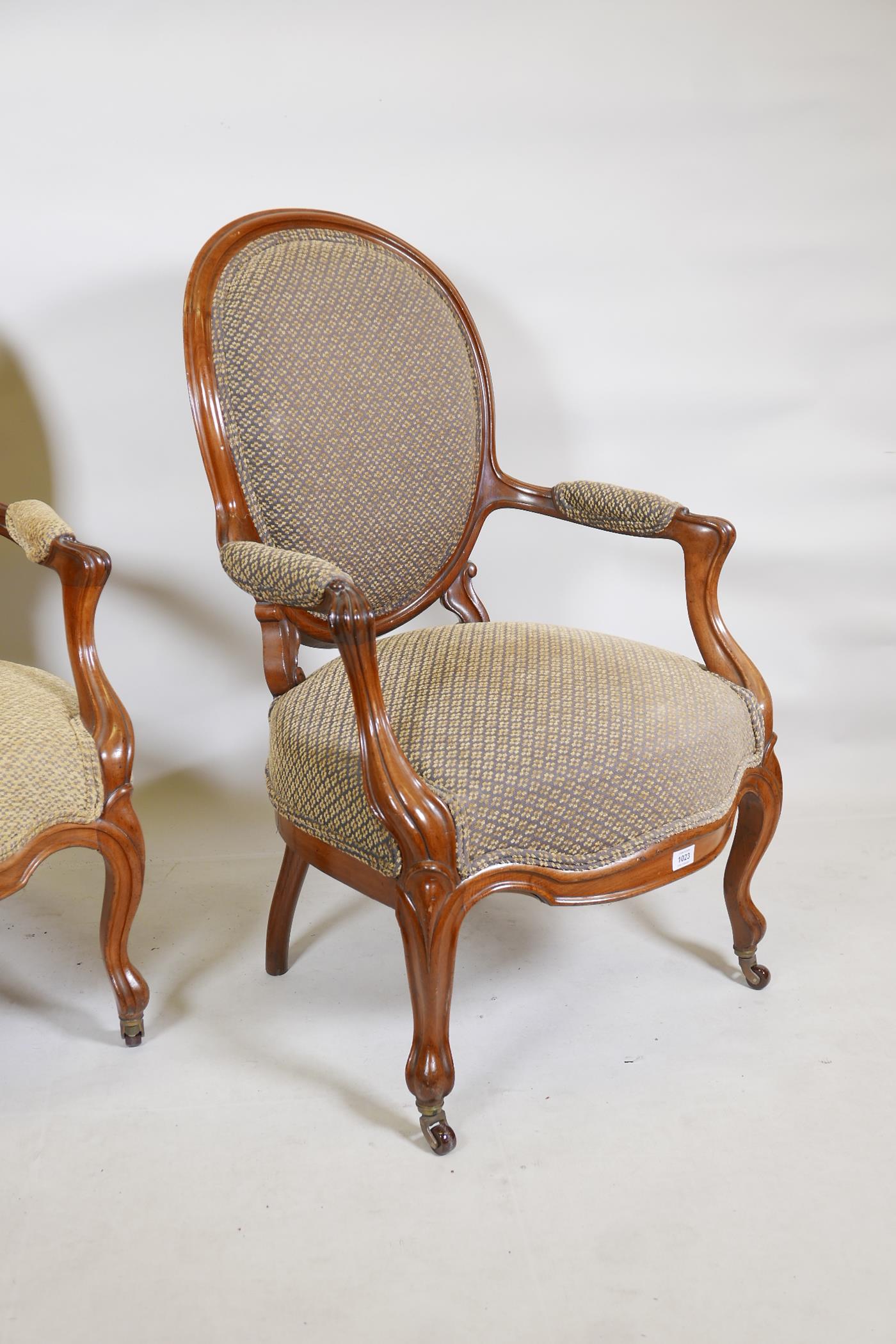 A pair of walnut spoonback open armchairs with carved and shaped arms, raised on cabriole supports - Image 3 of 4