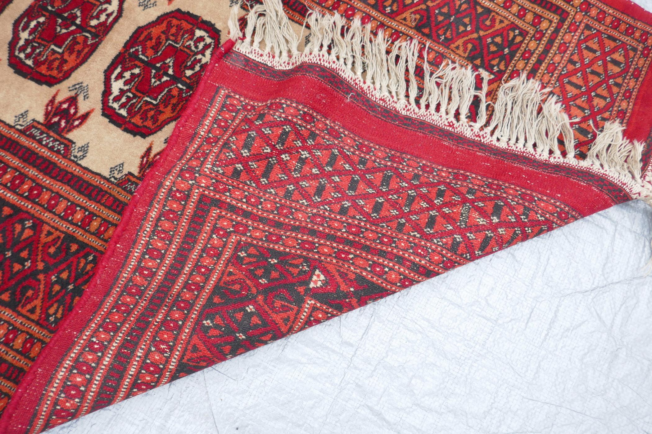 A red ground Turkmen wool rug with a Bokhara design on a cream field, 32" x 48", and another - Image 5 of 5