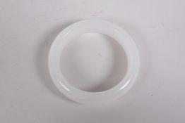 A white jade bangle, 3" diameter