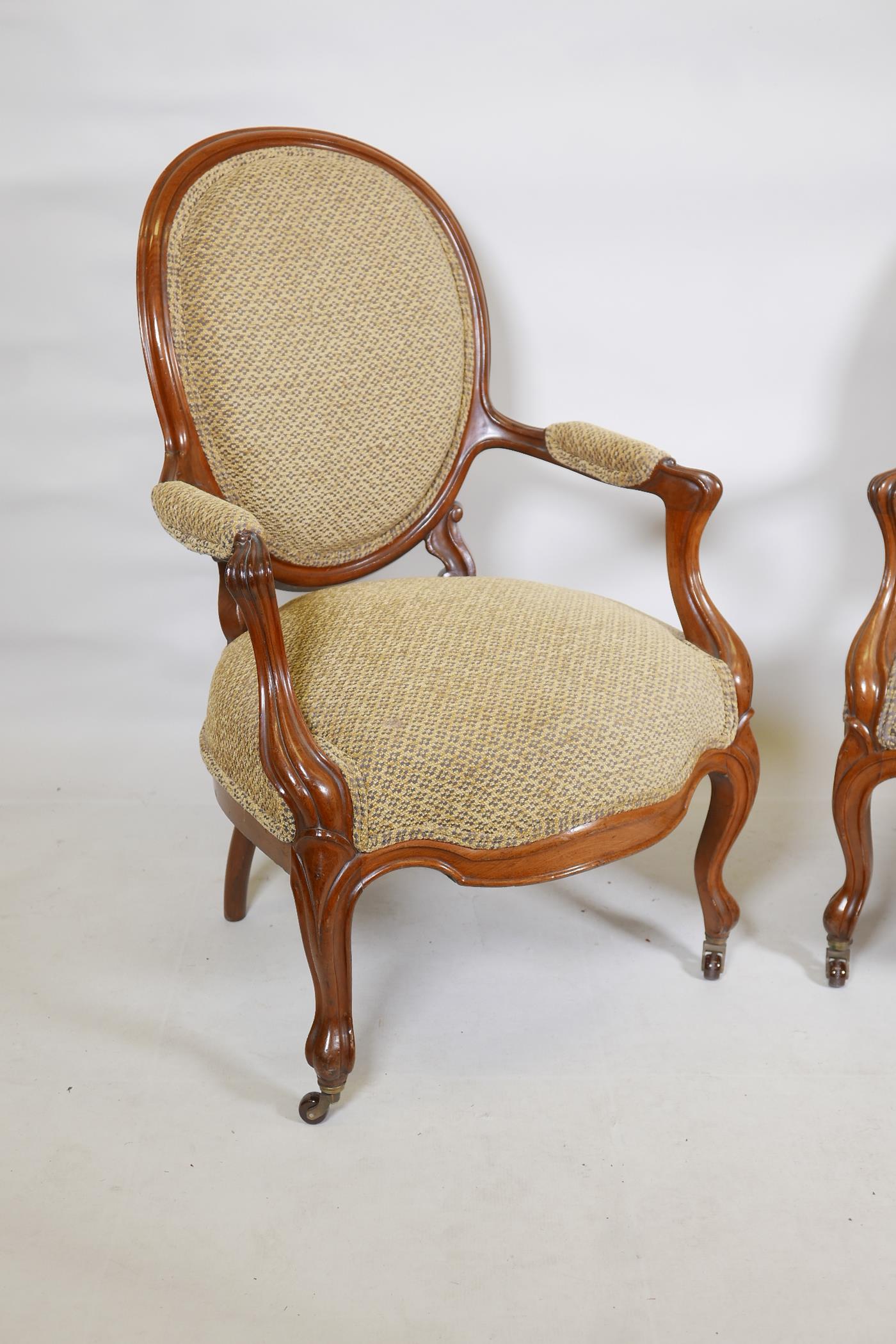 A pair of walnut spoonback open armchairs with carved and shaped arms, raised on cabriole supports - Image 4 of 4