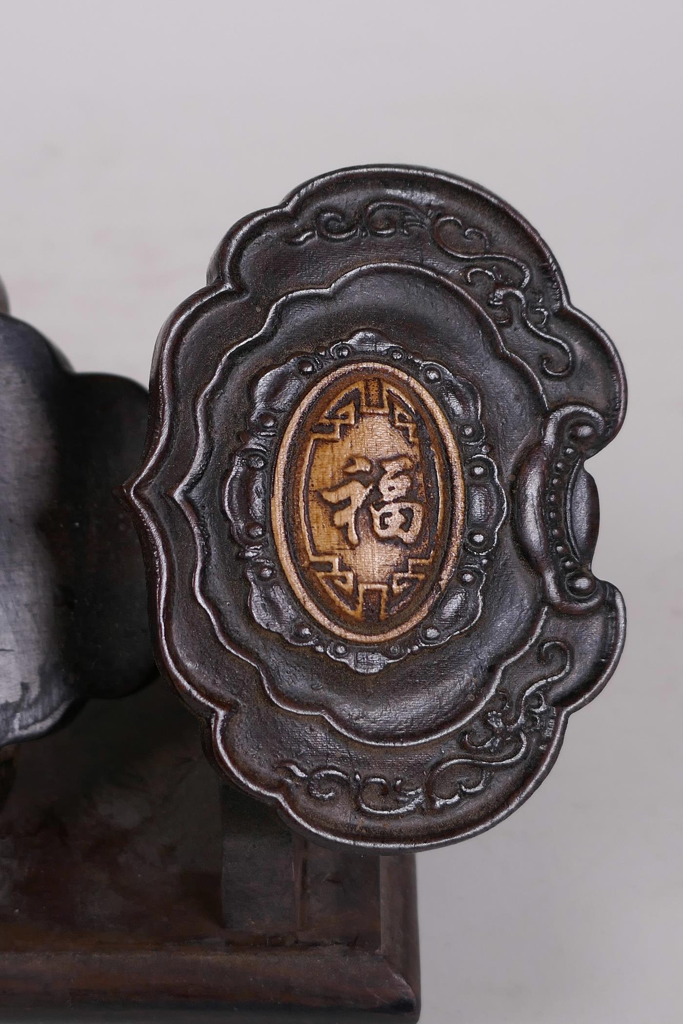 A Chinese carved hardwood abacus and stand in the form of a ruyi, with jade bead counters and - Image 4 of 4