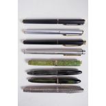 An assorted collection of Sheaffer fountain pens including a sterling silver cased pen, all appear