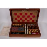 A John Jaques and Son Ltd mahogany cased games compendium, containing draughts, chess, bezique,