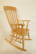 A beechwood Windsor rocking chair with lathe back