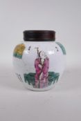 An early C20th Chinese famille rose ginger jar and hardwood cover decorated with three Immortals and
