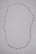 A white gold and cultured pearl necklace, 22" long